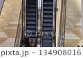 Time-lapse of people going up and down an escalator in a shopping mall 134908016