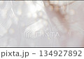 Abstract glossy blurry background, moving shiny waves against the sunlight, modern plastic futuristic backdrop 134927892