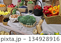 Vibrant summer fruits vegetables are beautifully arranged in baskets at marketplace. 134928916