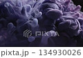 Abstract swirls of purple and gray ink in water creating a floral form 134930026