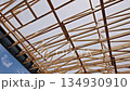 Workers build wooden roof trusses frame with beams joins forming structure 134930910
