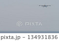 Airliner approaching landing over ocean 134931836