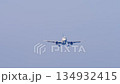 Jet airplane descending landing 134932415