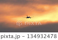 Shot of jet plane in sunset sky 134932478
