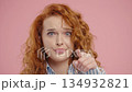Stylish Modern Ginger Businesswoman With Gesture - You, Think About It. Intelligent woman on Pink 134932821
