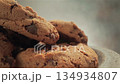 Close-up of freshly baked oatmeal cookies with chocolate chips, camera moves slowly 134934807