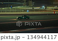 Sports car on race track at night 134944117