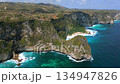 Aerial view of scenic cliffs and turquoise water on Nusa Penida Island, Bali, Indonesia. Stunning landscape ideal for travel, nature, and tropical paradise themes. 134947826