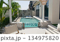 A small private swimming pool in the backyard of a luxury villa in Dubai on a sunny day 134975820