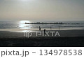 walking on the beach on sunset 134978538