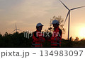 Two engineer working at a wind turbine power generation site. 134983097