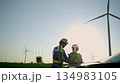 Two engineer working at a wind turbine power generation site. 134983105