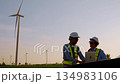 Two engineer working at a wind turbine power generation site. 134983106