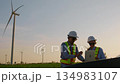 Two engineer working at a wind turbine power generation site. 134983107