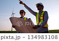 Two engineer working at a wind turbine power generation site. 134983108