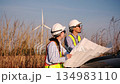 Two engineer working at a wind turbine power generation site. 134983110
