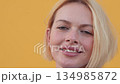 Closeup portrait of smiling woman with blonde hair 134985872