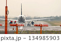 Airplane on runway in haze 134985903