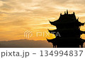 Silhouette of Historic Temple Against Golden Sunset Sky 134994837