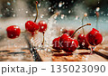 Fresh ripe cherries splashing in water in vibrant close-up slow motion on wood with glistening drops and natural bokeh background 135023090