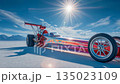 Top fuel dragster racing car on sunlit salt desert with clear sky 135023109