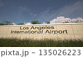 Arrivals at Los Angeles International Airport with airplane landing near terminal, Los Angeles, United States 135026223