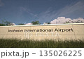 Arrivals at Incheon International Airport with airplane landing near terminal, Seoul, South Korea 135026225