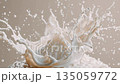 Frozen splash of milk or cream swirling and splashing upward in mid-air with detailed droplets against a beige background for dairy, freshness, or fluidity concepts 135059772