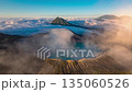 Drone hyperlapse aerial view flying orbit around mountain Kawah Ijen volcano crater, Indonesia  135060526