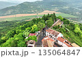Cinematic drone footage of Motovun medieval town on hilltop in Istria Croatia during early summer with stone houses, green valley, vineyards and authentic European heritage landscape 135064847