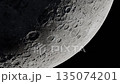 Moon Surface Close-Up With Cratered Terrain And Curved Horizon In Space At Dusk 135074201