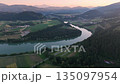 Cinematic drone footage of Drava river during blue hour, deep colors, calm water, soft gradients, evening stillness, smooth aerial movement, atmospheric summer scene 135097954