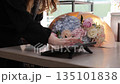 Florist processing a flower order using a tablet 135101838