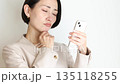 A woman using a smartphone 135118255