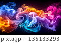 Abstract vibrant rainbow smoke creating flowing wavy patterns on dark background. 135133293