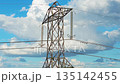 High voltage tower supporting wires against cloudy sky. High voltage cables stretching in transmission system. Steel pylon carrying electric lines under blue sky 135142455