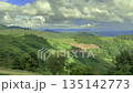 Slow panning shot of mountain landscape during daytime in Asia. Lush green forest, natural scenery, peaceful atmosphere, no people. Ideal for travel, nature, documentary, relaxation, and environmental 135142773