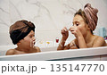 Two children playing with bath foam together at home during evening routine 135147770