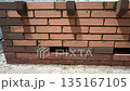 fresh brickwork of a heating stove bench. heat outlets of the bench are visible 135167105