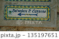 Hand painted Belvedere di Punta Cannone direction sign on stone wall in Capri Italy 135197651