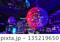 Sofia, Bulgaria - 12.31.2025. Shining bright disco ball in neon pink lighting in dance night club night party. 135219650