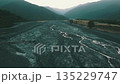 Aerial view displays a serene mountain river landscape, embodying tranquility and beauty 135229747