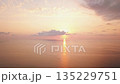 A Stunning Sunrise Displaying Colors Over the Tranquil Ocean Waters Captivates the Soul 135229751