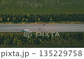 An Aerial View of a Busy Highway in Russia, Surrounded by Beautiful Green Fields and Scenery 135229758