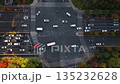 Aerial top view of urban traffic moving through Intersection at daytime in China during autumn season 135232628