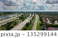 Complex highway overpass elevated direction lanes with busy traffic in Miami, Florida. American high speed road crossroads 135299144