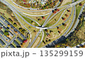 American freeway intersection with fast driving cars and trucks. View from above of USA transportation infrastructure 135299159