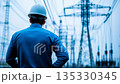 Electrical Engineer Surveying High Voltage Transmission Infrastructure 135330345