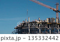 Construction of a building. Construction site with crane. Business, development, industry. 135332442