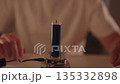 Scientist conducting tesla coil experiment, high-voltage arcs wirelessly lighting leds, demonstrating electromagnetic induction, energy transfer and physics in dark lab setting, close-up, slow motion. 135332898